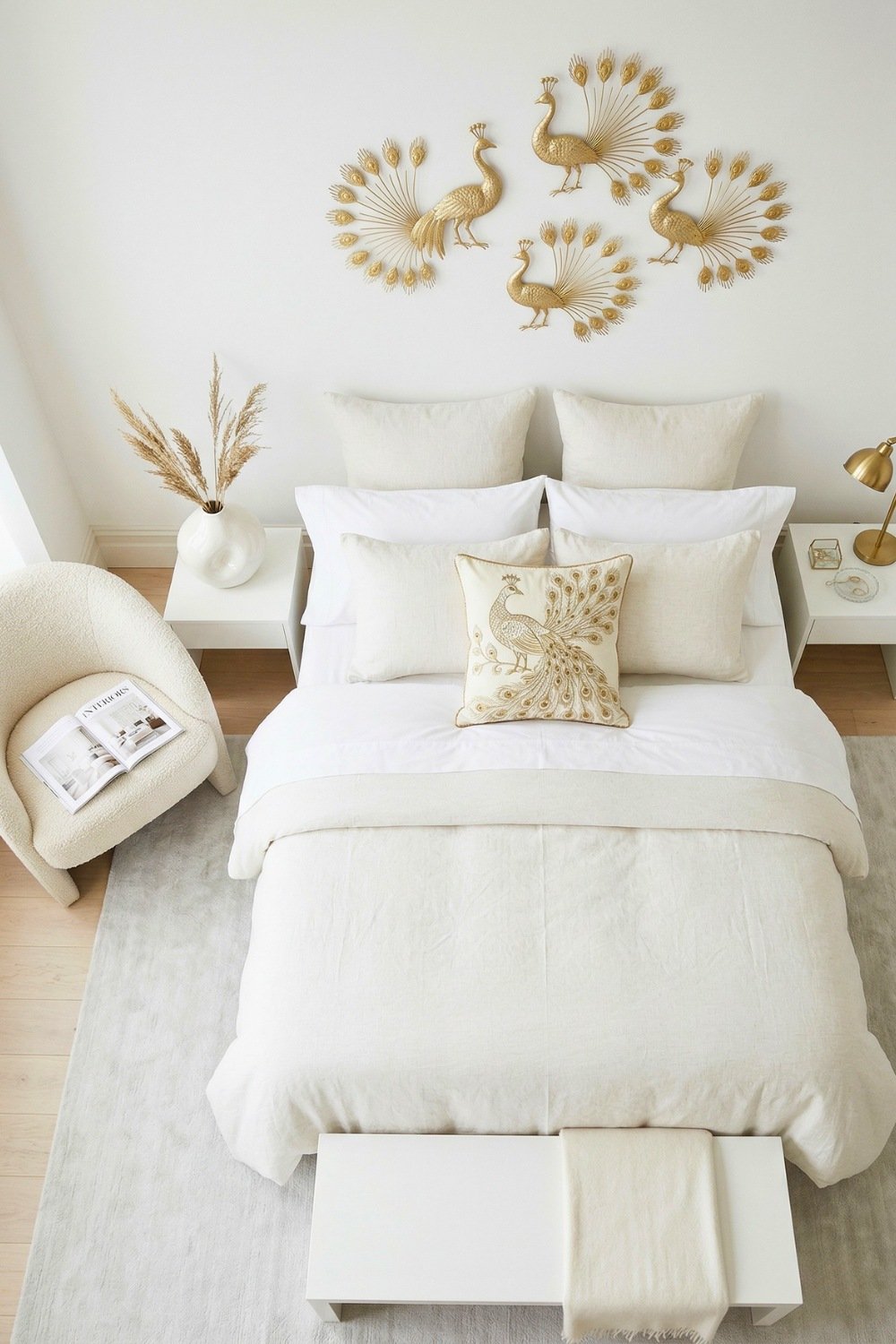 Minimalist Bedroom Featuring Gold Peacock Wall Art On A White And Beige Background