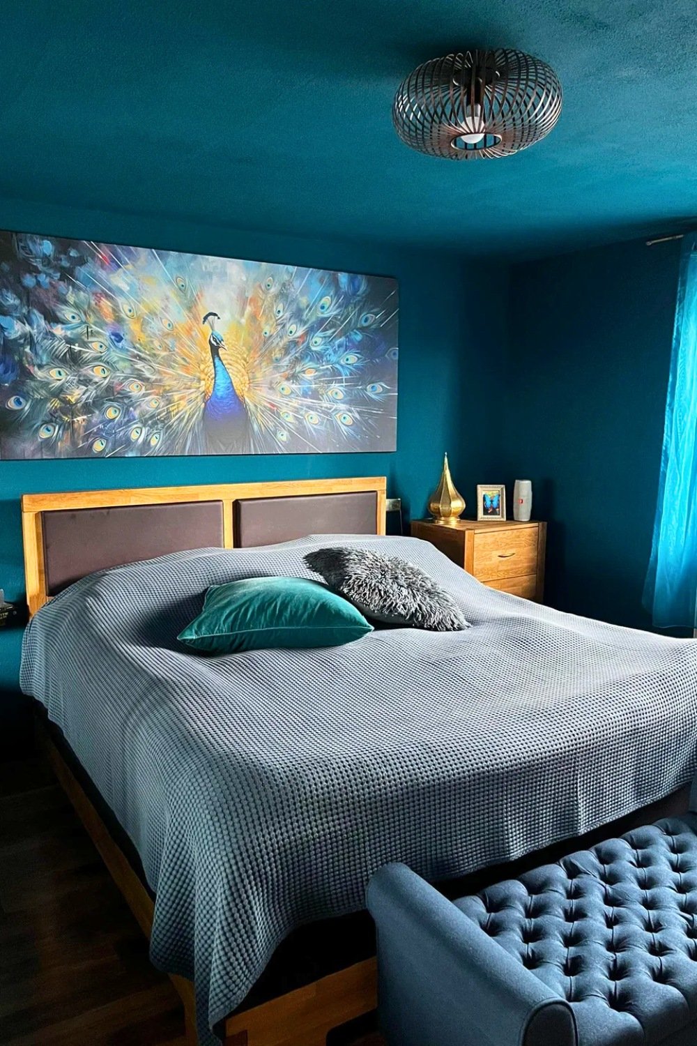 Teal Master Bedroom With Large Peacock Wall Art And Moody Paint